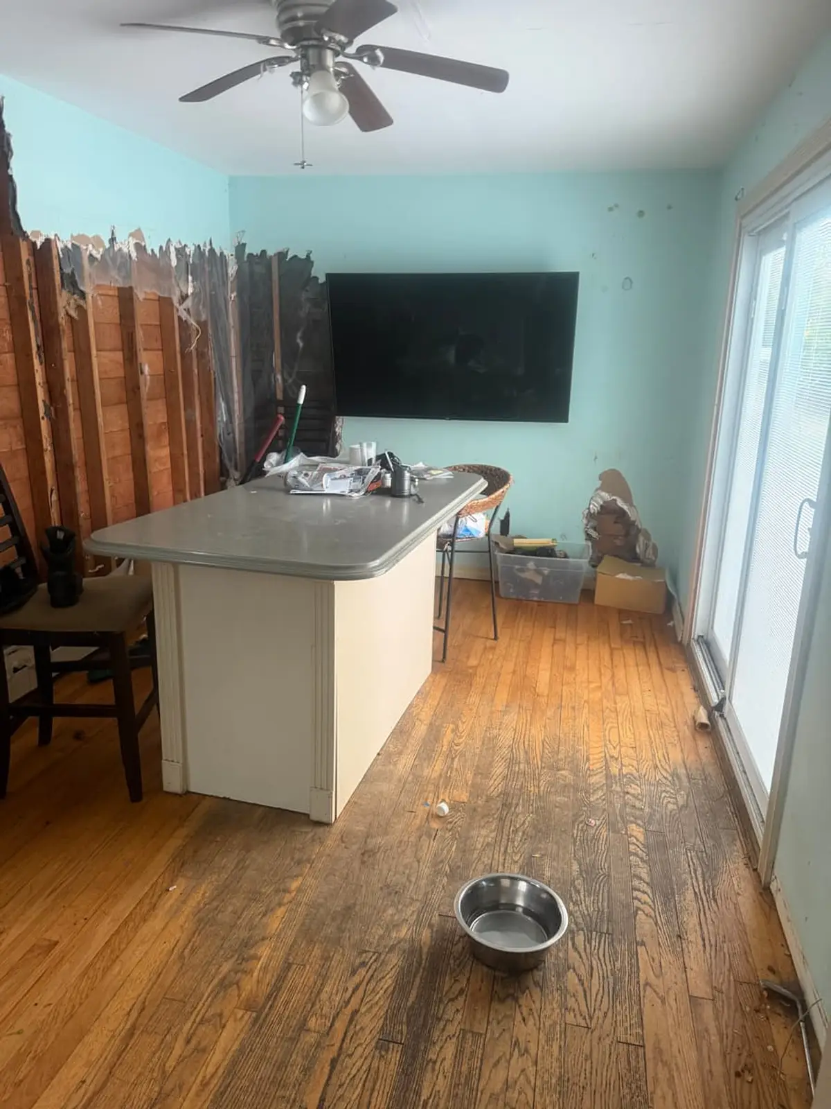 Wondering what your Patchogue house is worth: kitchen with a peninsula counter and a stained wood floor